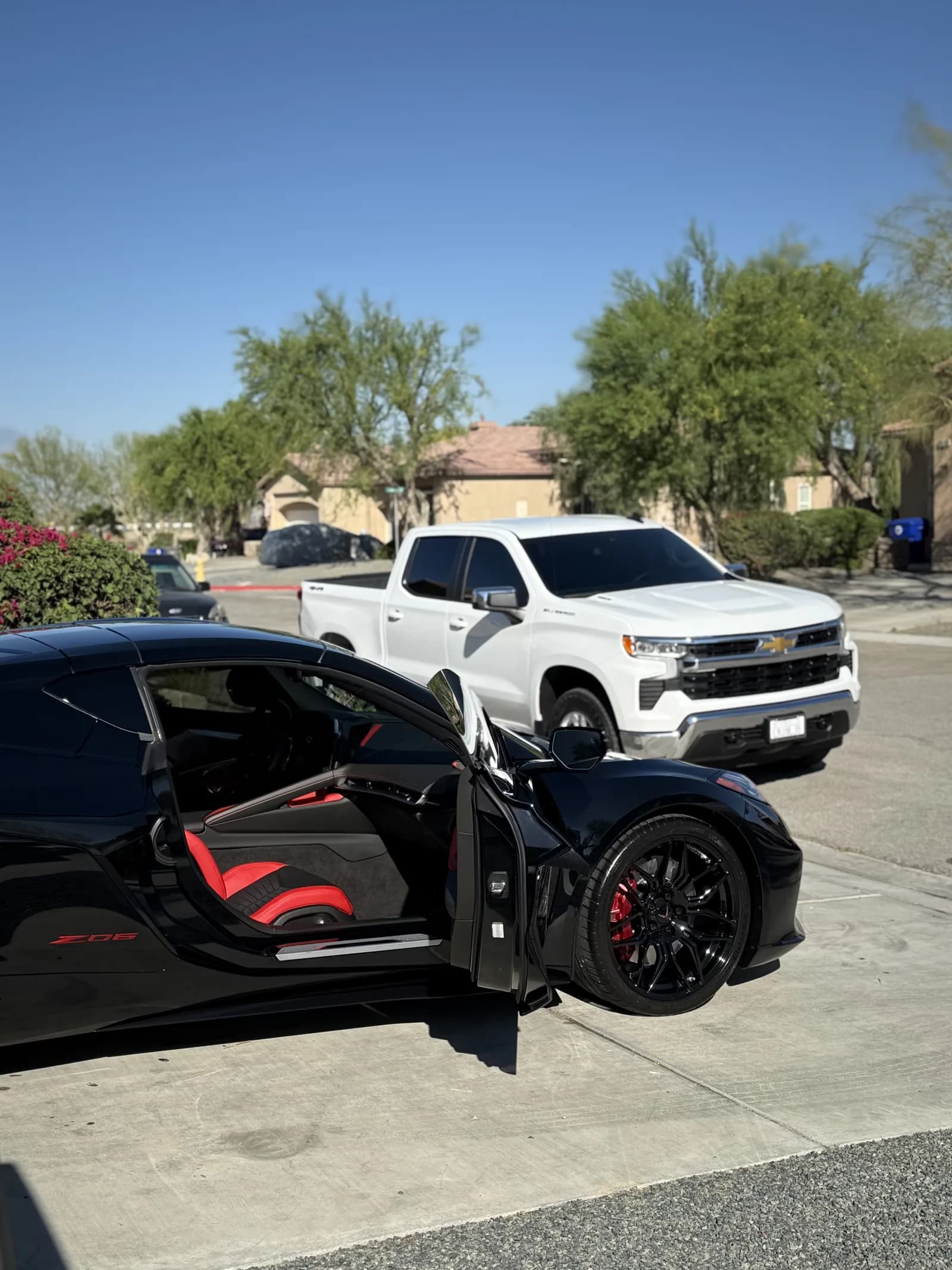 Black Corvette with its red interior revealed